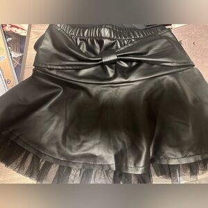 Girls black faux leather skirt with a tulle trim sz 4/5